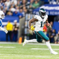 Nov 20, 2022; Indianapolis, Indiana, USA; Philadelphia Eagles wide receiver A.J. Brown (11) runs with the ball while Indianapolis Colts linebacker Zaire Franklin (44) defends in the first quarter at Lucas Oil Stadium.