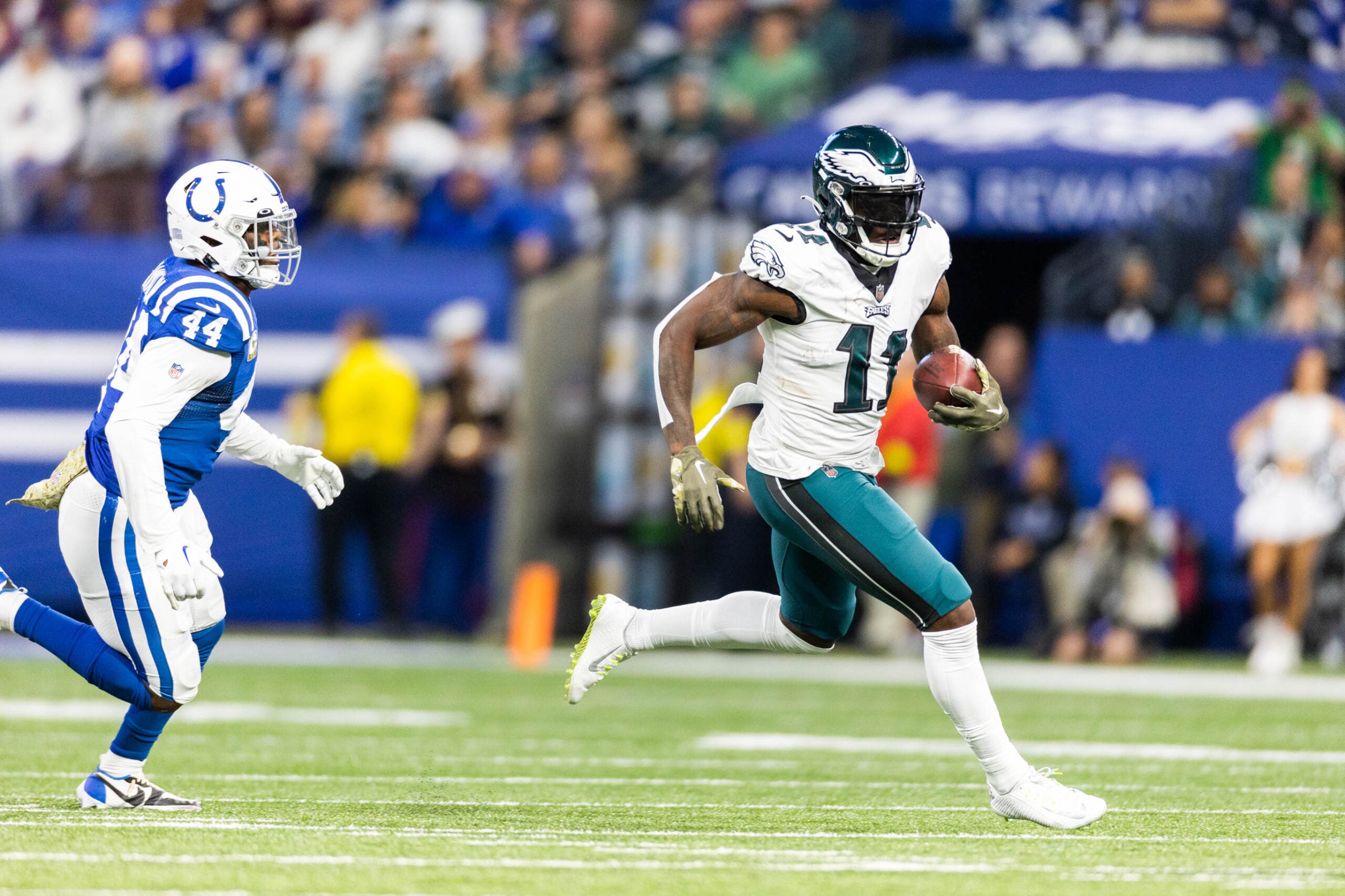 Nov 20, 2022; Indianapolis, Indiana, USA; Philadelphia Eagles wide receiver A.J. Brown (11) runs with the ball while Indianapolis Colts linebacker Zaire Franklin (44) defends in the first quarter at Lucas Oil Stadium.