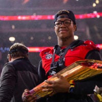Jan 9, 2023; Inglewood, CA, USA; Georgia Bulldogs linebacker Nolan Smith (4) celebrates with the championship trophy after defeating the TCU Horned Frogs during the CFP national championship game at SoFi Stadium.