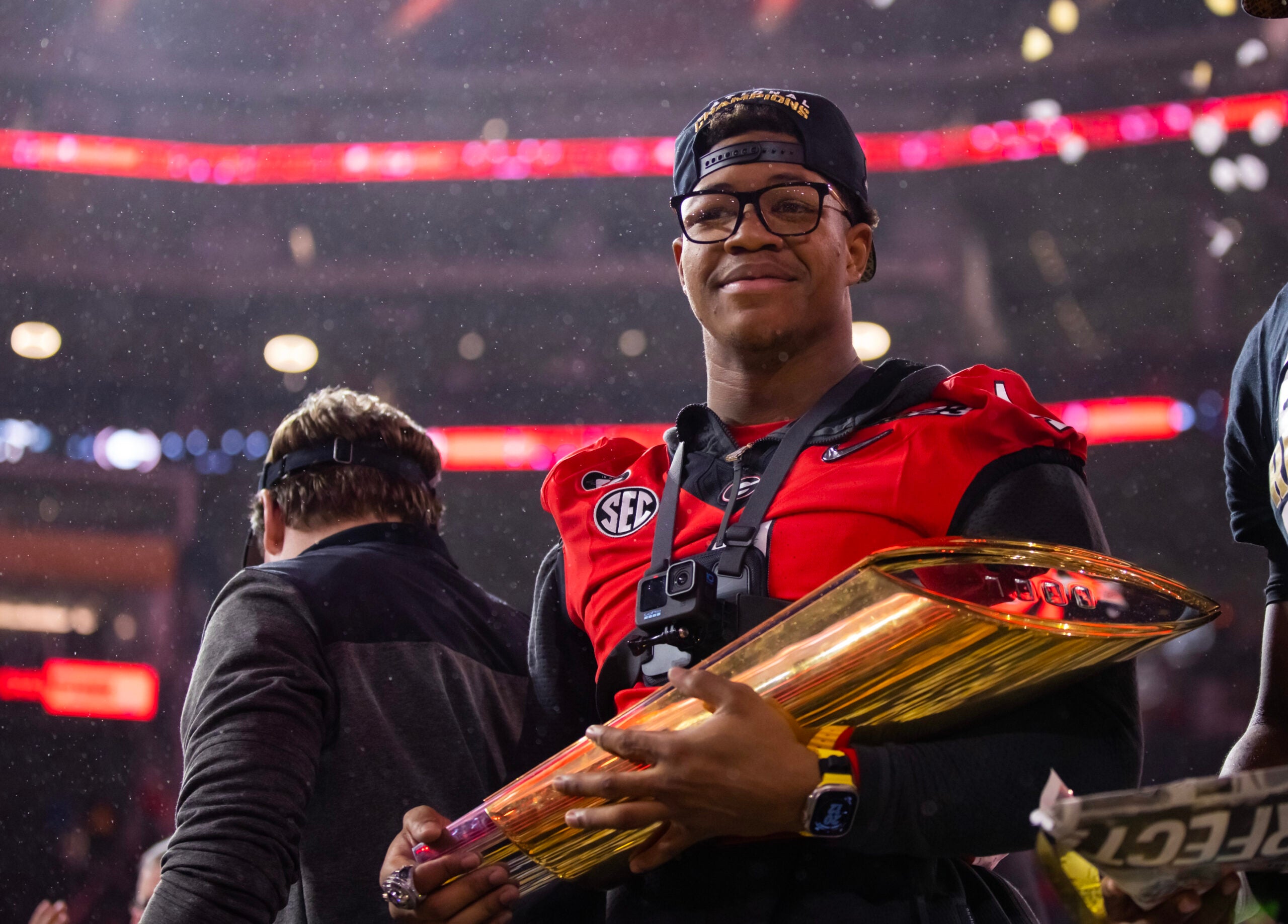 Jan 9, 2023; Inglewood, CA, USA; Georgia Bulldogs linebacker Nolan Smith (4) celebrates with the championship trophy after defeating the TCU Horned Frogs during the CFP national championship game at SoFi Stadium.