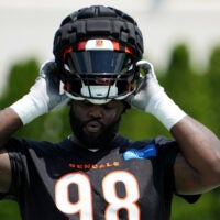 July 31, 2023; Cincinnati, OH, USA; Cincinnati Bengals defensive tackle DJ Reader (98) puts on his helmet during NFL training camp practice, Monday, July 31, 2023, in Cincinnati.