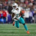 Sep 17, 2023; Foxborough, Massachusetts, USA; Miami Dolphins running back Salvon Ahmed (26) runs the ball during the first half against the New England Patriots at Gillette Stadium.