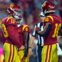 Oct 7, 2023; Los Angeles, California, USA; Southern California Trojans quarterback Caleb Williams (13) celebrates his touchdown scored against the Arizona Wildcats with wide receiver Kyron Hudson (10) during the second half at Los Angeles Memorial Coliseum.