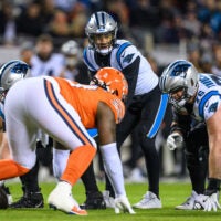 Nov 9, 2023; Chicago, Illinois, USA; Carolina Panthers quarterback Bryce Young (9) stands over center against the Chicago Bears during the second quarter at Soldier Field.