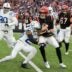 Indianapolis Colts cornerback Kenny Moore II (23) works to bring down Cincinnati Bengals quarterback Jake Browning (6) on Sunday, Dec. 10, 2023, during a game against the Cincinnati Bengals at Paycor Stadium in Cincinnati.