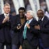 Dec 30, 2023; Arlington, Texas, USA; Dallas Cowboys former head coach Jimmy Johnson laughs with former players Troy Aikman and Michael Irvin and Emmitt Smith after being inducted into the ring of honor at halftime of the game against the Detroit Lions at AT&T Stadium.