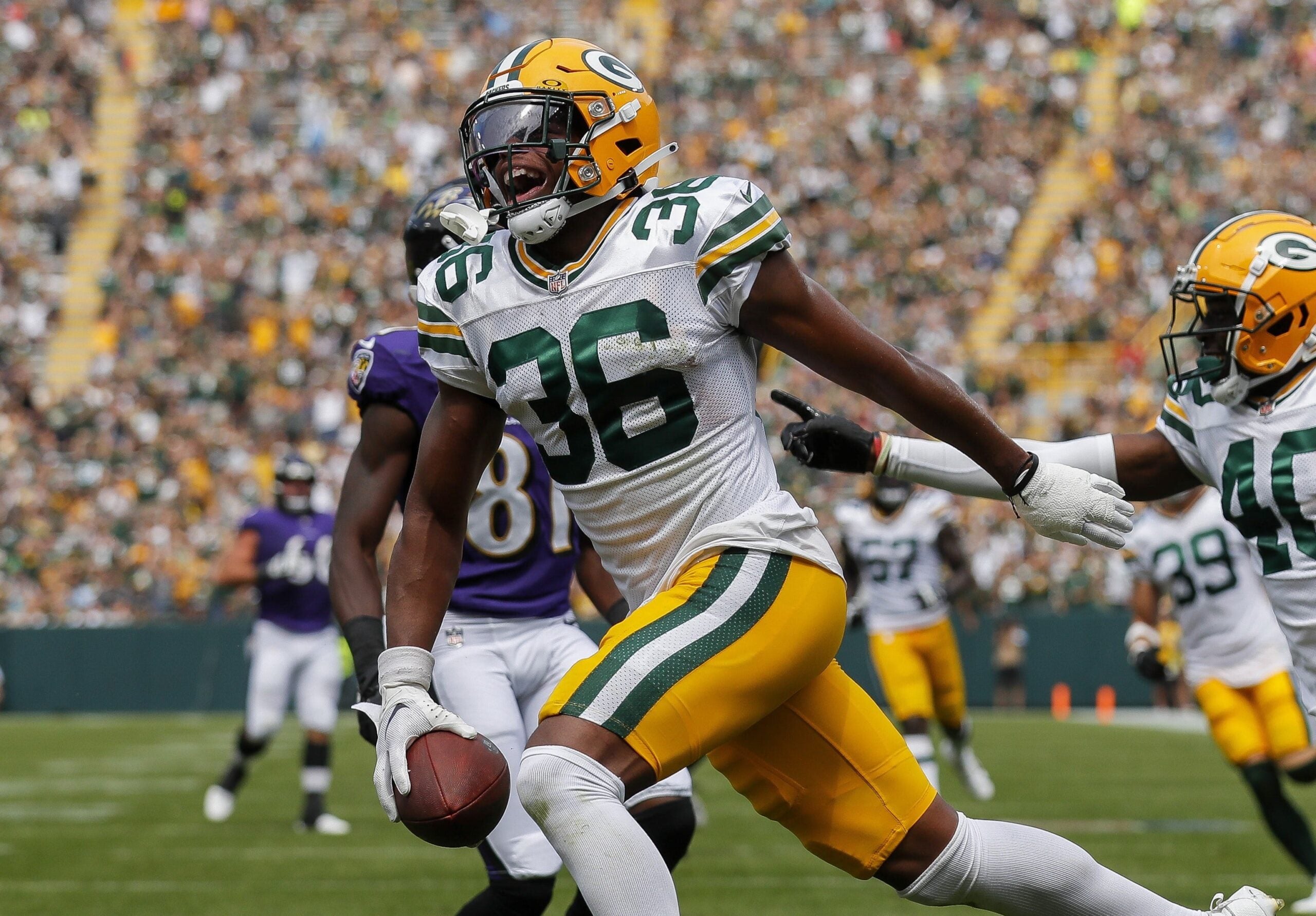 Green Bay Packers safety Anthony Johnson Jr. (36) celebrates after returning a fumble for a touchdown against the Baltimore Ravens during an NFL preseason game on Saturday, August 24, 2024, at Lambeau Field in Green Bay, Wis.