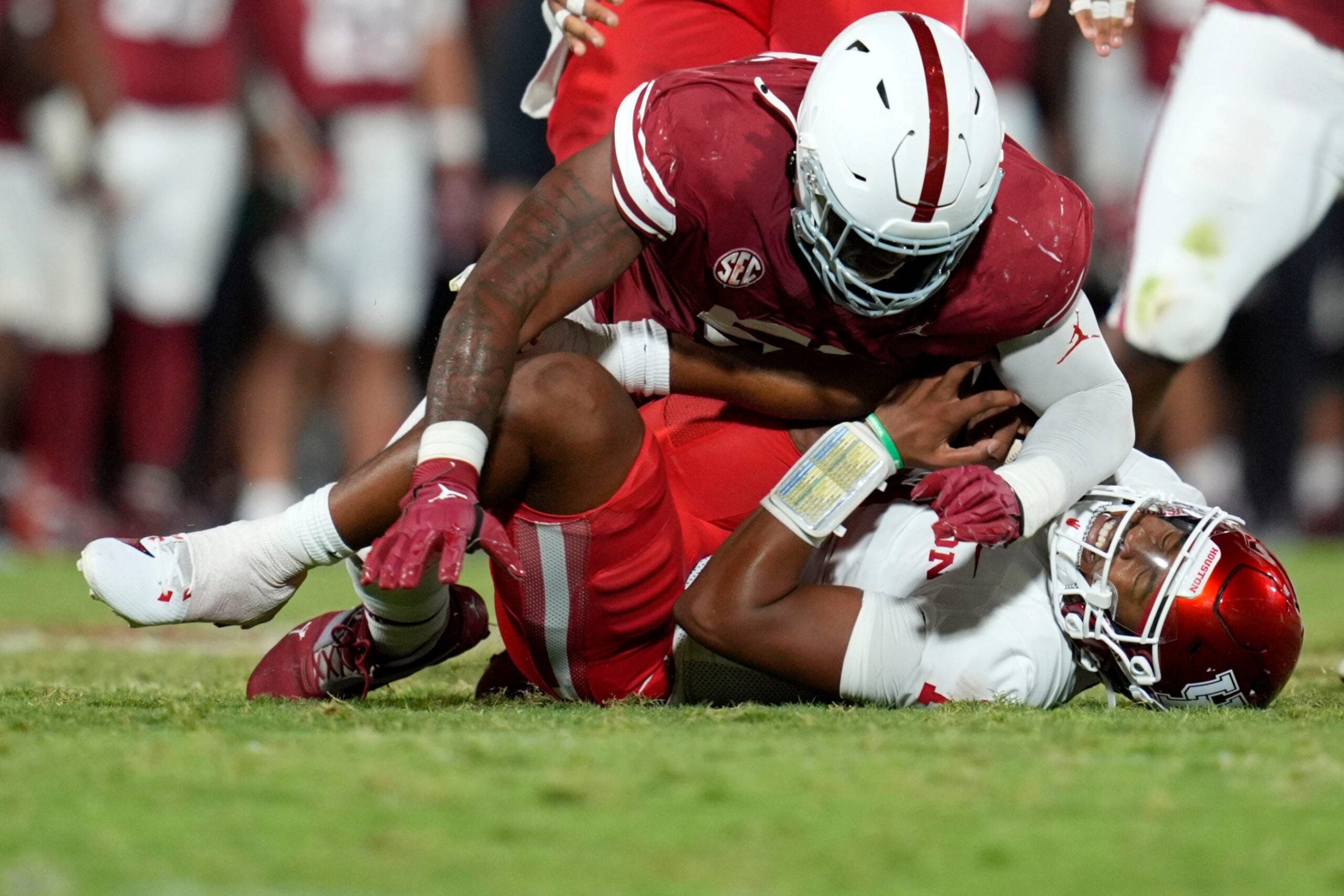 Oklahoma Sooners defensive lineman Gracen Halton (56) sacks Houston Cougars quarterback Donovan Smith (1) during a college football game between the University of Oklahoma Sooners (OU) and the Houston Cougars at Gaylord Family – Oklahoma Memorial Stadium in Norman, Okla., Saturday, Sept. 7, 2024.