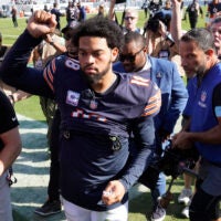 Oct 6, 2024; Chicago, Illinois, USA; Chicago Bears quarterback Caleb Williams (18) gestures to the crowd after the game against the Carolina Panthers at Soldier Field.