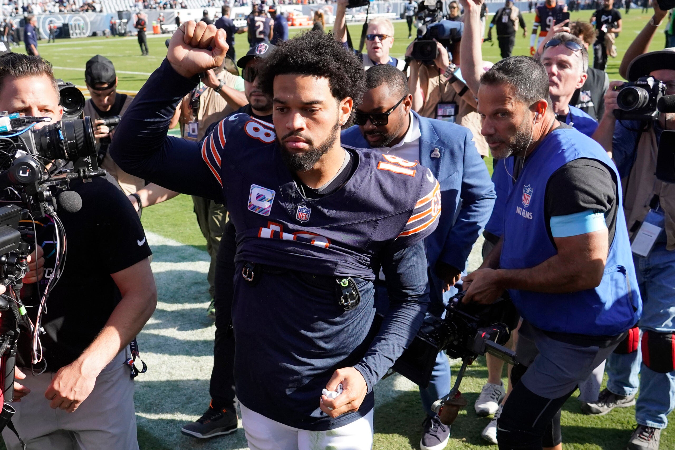 Oct 6, 2024; Chicago, Illinois, USA; Chicago Bears quarterback Caleb Williams (18) gestures to the crowd after the game against the Carolina Panthers at Soldier Field.