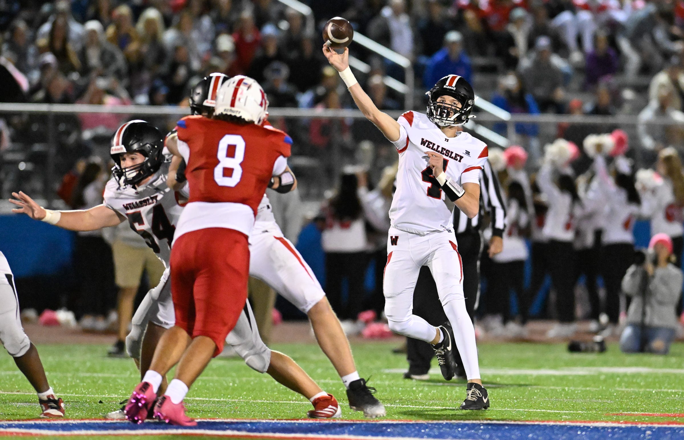 Wellesley sophomore quarterback Lukas Prock passes the ball during a football game against Natick at Memorial Field in Natick, Friday, Oct. 25, 2025. Natick High School football defeated Wellesley, 27-19.