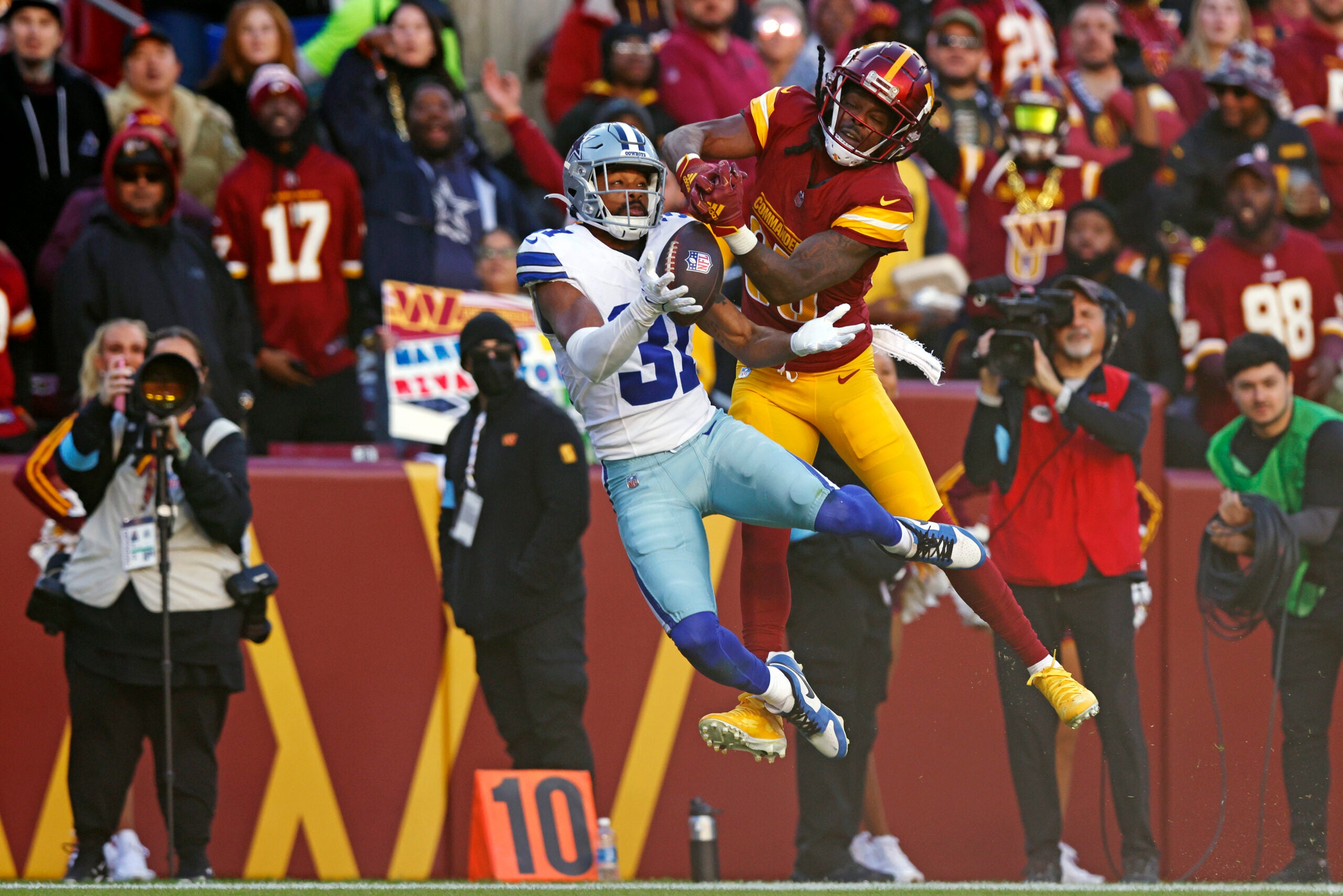 Nov 24, 2024; Landover, Maryland, USA; Dallas Cowboys cornerback Josh Butler (31) breaks up a pass intended for Washington Commanders wide receiver Noah Brown (85) during the second quarter at Northwest Stadium.