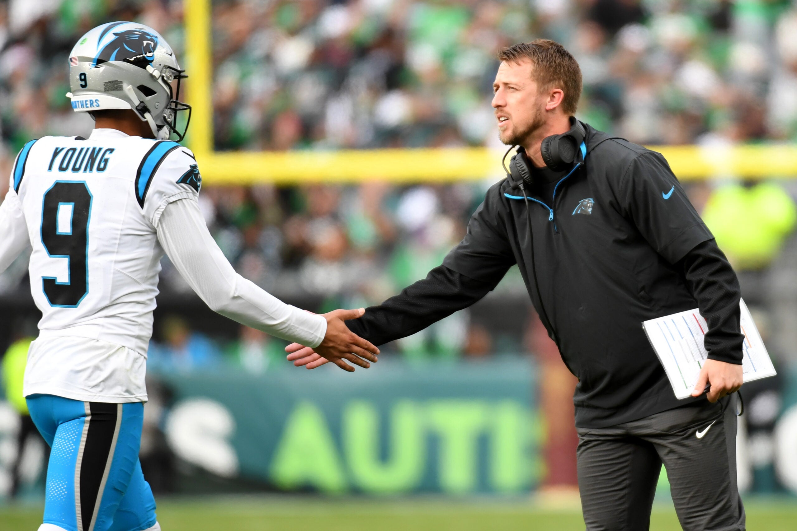 Dec 8, 2024; Philadelphia, Pennsylvania, USA; Carolina Panthers quarterback Bryce Young (9) and offensive coordinator Brad Idzik against the Philadelphia Eagles at Lincoln Financial Field.