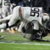 Dec 14, 2024; Landover, Maryland, USA; Navy Midshipmen defensive tackle Landon Robinson (96) fumbles after colliding with Army Black Knights linebacker Baylor Newsom (21) on a punt return at Commanders Field.
