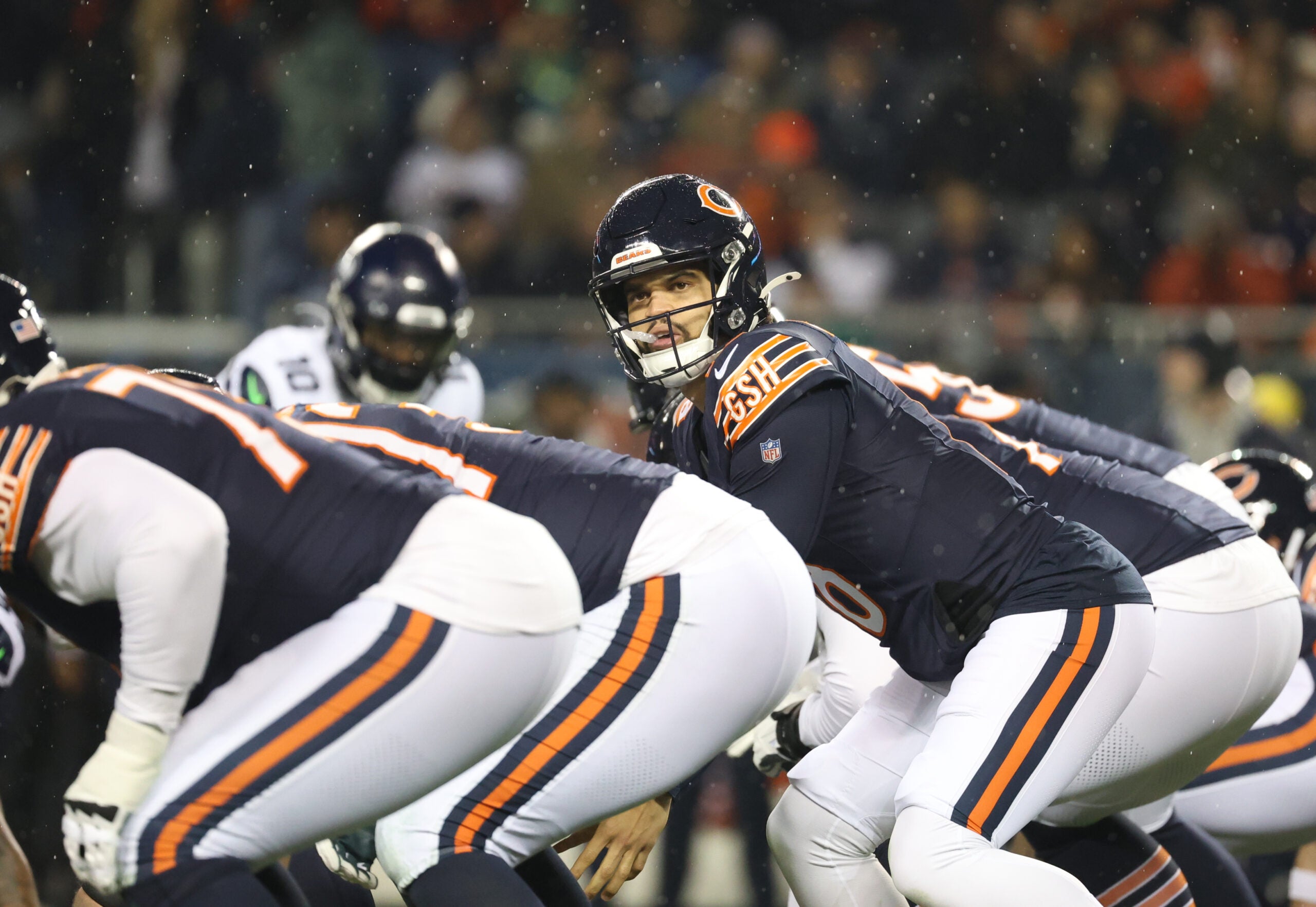 Dec 26, 2024; Chicago, Illinois, USA; Chicago Bears quarterback Caleb Williams (18) looks downfield before the snap during the first quarter against the Seattle Seahawks at Soldier Field.