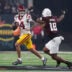 Dec 27, 2024; Las Vegas, NV, USA; Southern California Trojans quarterback Jayden Maiava (14) throws the ball against Texas A&M Aggies defensive lineman Cashius Howell (18) in the first half at Allegiant Stadium.
