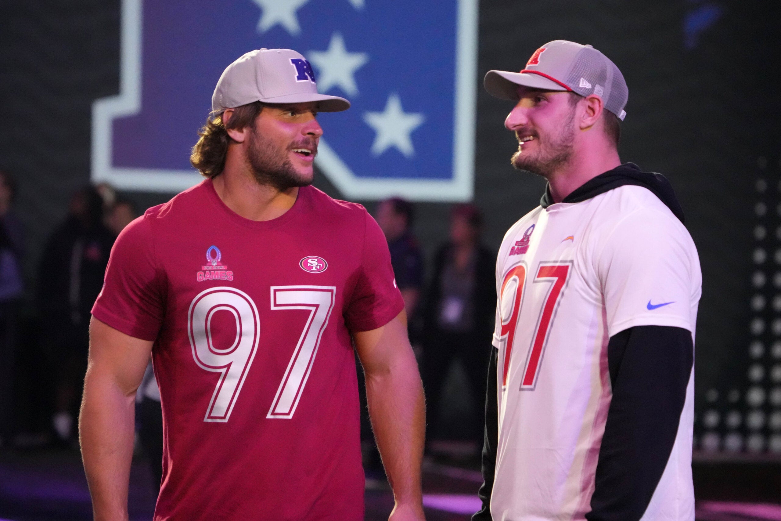 Jan 30, 2025; Orlando, FL, USA; NFC defensive end Nick Bosa of the San Francisco 49ers (left) with brother and AFC linebacker Joey Bosa during the Pro Bowl Skills Challenge at Nicholson Fieldhouse.