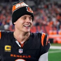 Bengals quarterback Joe Burrow celebrates a Week 17 overtime win over the Denver Broncos that kept Cincinnati's slim playoff hopes alive. Burrow threw for 412 yards and three touchdowns in the game and also added a rushing score.