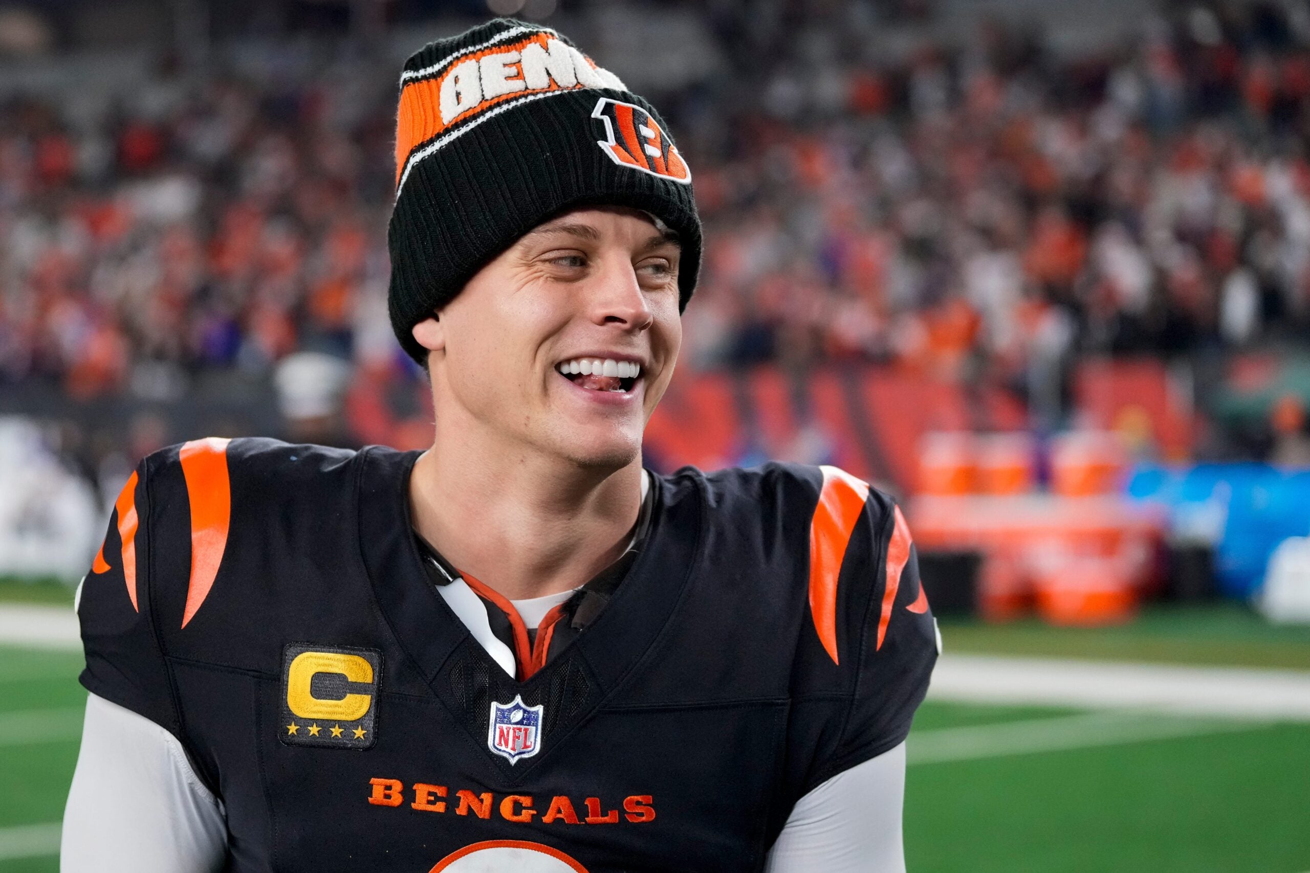 Bengals quarterback Joe Burrow celebrates a Week 17 overtime win over the Denver Broncos that kept Cincinnati's slim playoff hopes alive. Burrow threw for 412 yards and three touchdowns in the game and also added a rushing score.