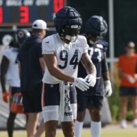 Jul 23, 2025; Lake Forest, IL, USA; Chicago Bears defensive end Austin Booker (94) stretches during training camp at Halas Hall.