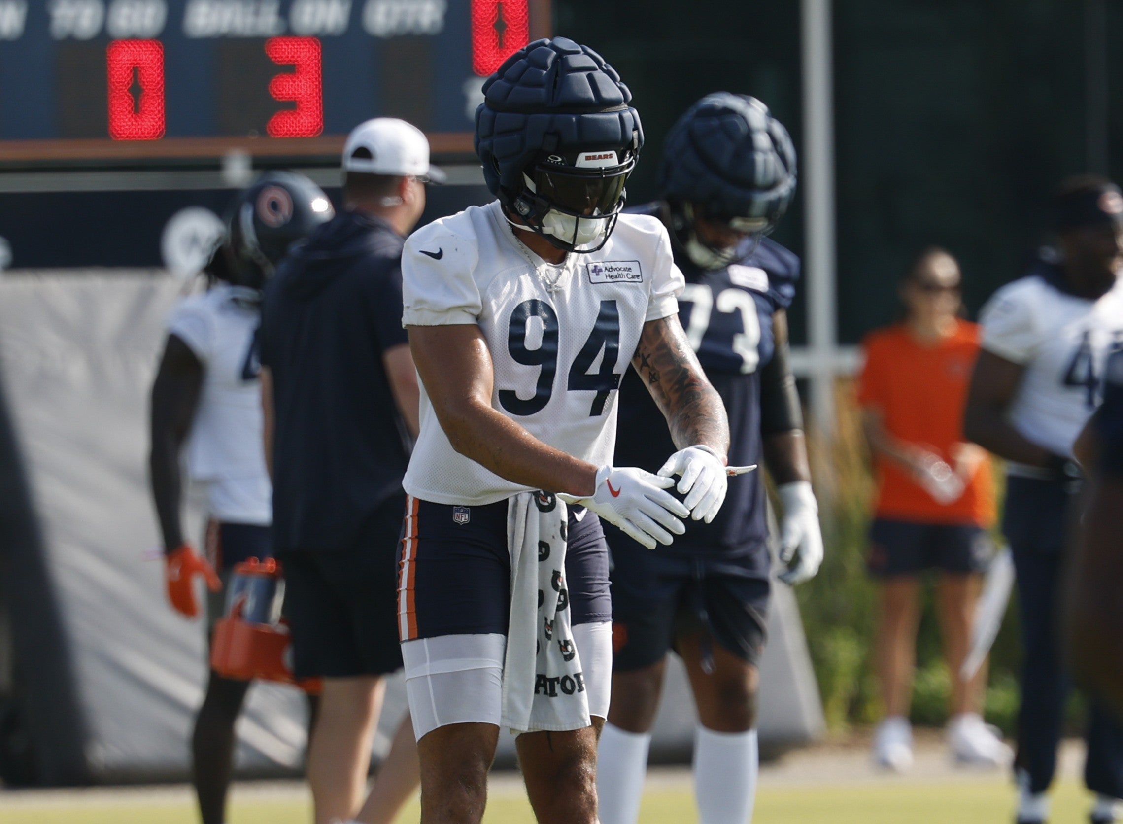 Jul 23, 2025; Lake Forest, IL, USA; Chicago Bears defensive end Austin Booker (94) stretches during training camp at Halas Hall.