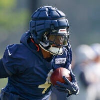 Jul 23, 2025; Lake Forest, IL, USA; Chicago Bears running back D'Andre Swift (4) runs with the ball during training camp at Halas Hall.
