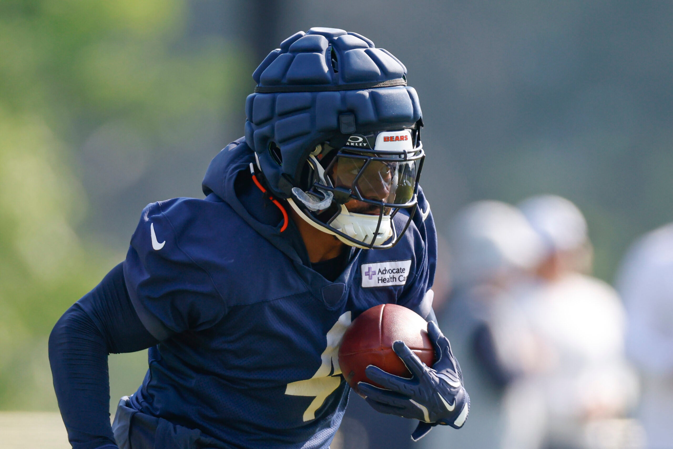 Jul 23, 2025; Lake Forest, IL, USA; Chicago Bears running back D'Andre Swift (4) runs with the ball during training camp at Halas Hall.
