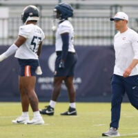 Jul 24, 2025; Lake Forest, IL, USA; Chicago Bears head coach Ben Johnson walks on the field during training camp at Halas Hall.