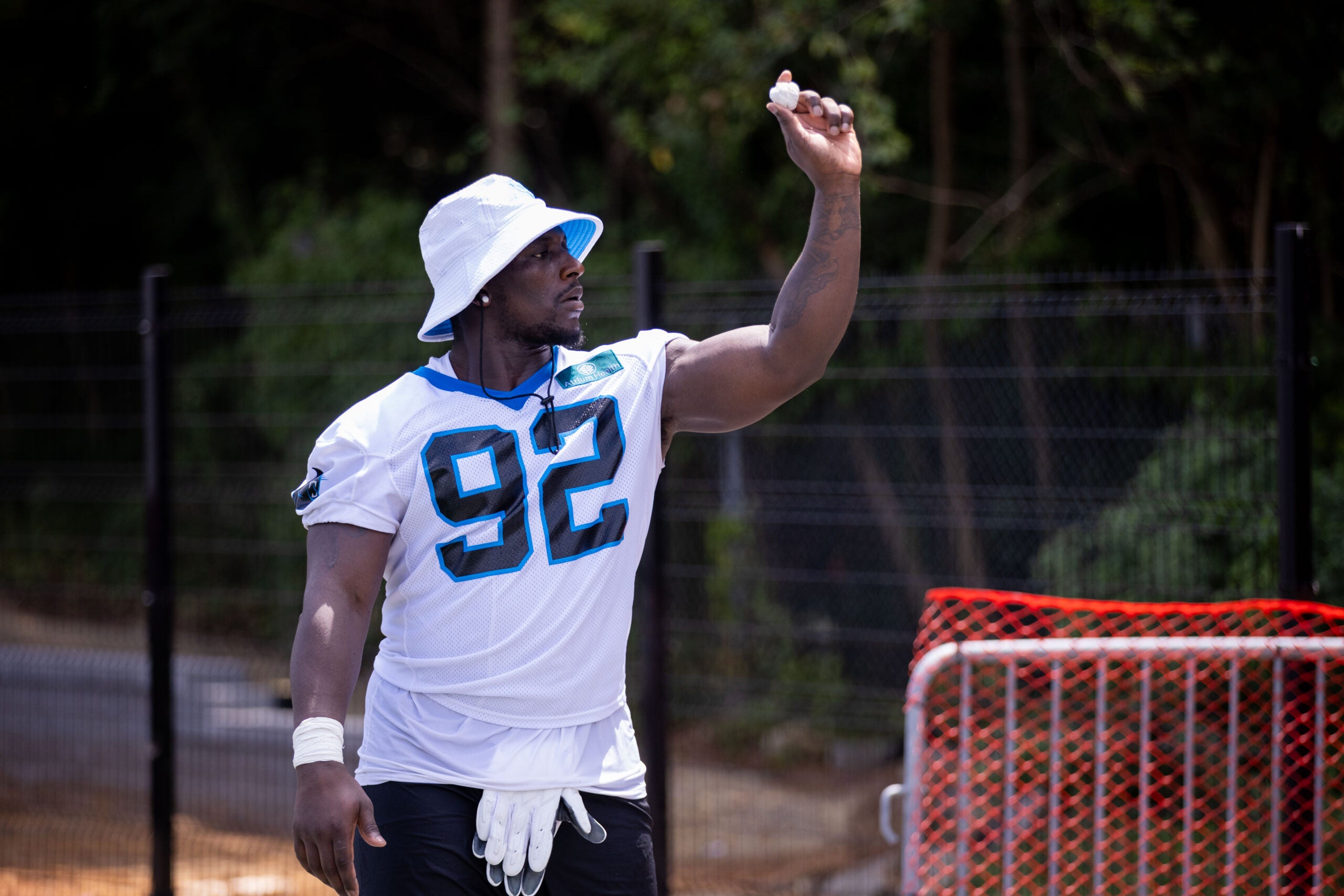 Jul 24, 2025; Charlotte, NC, USA; Carolina Panthers defensive tackle Tershawn Wharton (92) plays around as he waits to be interviewed during training camp.