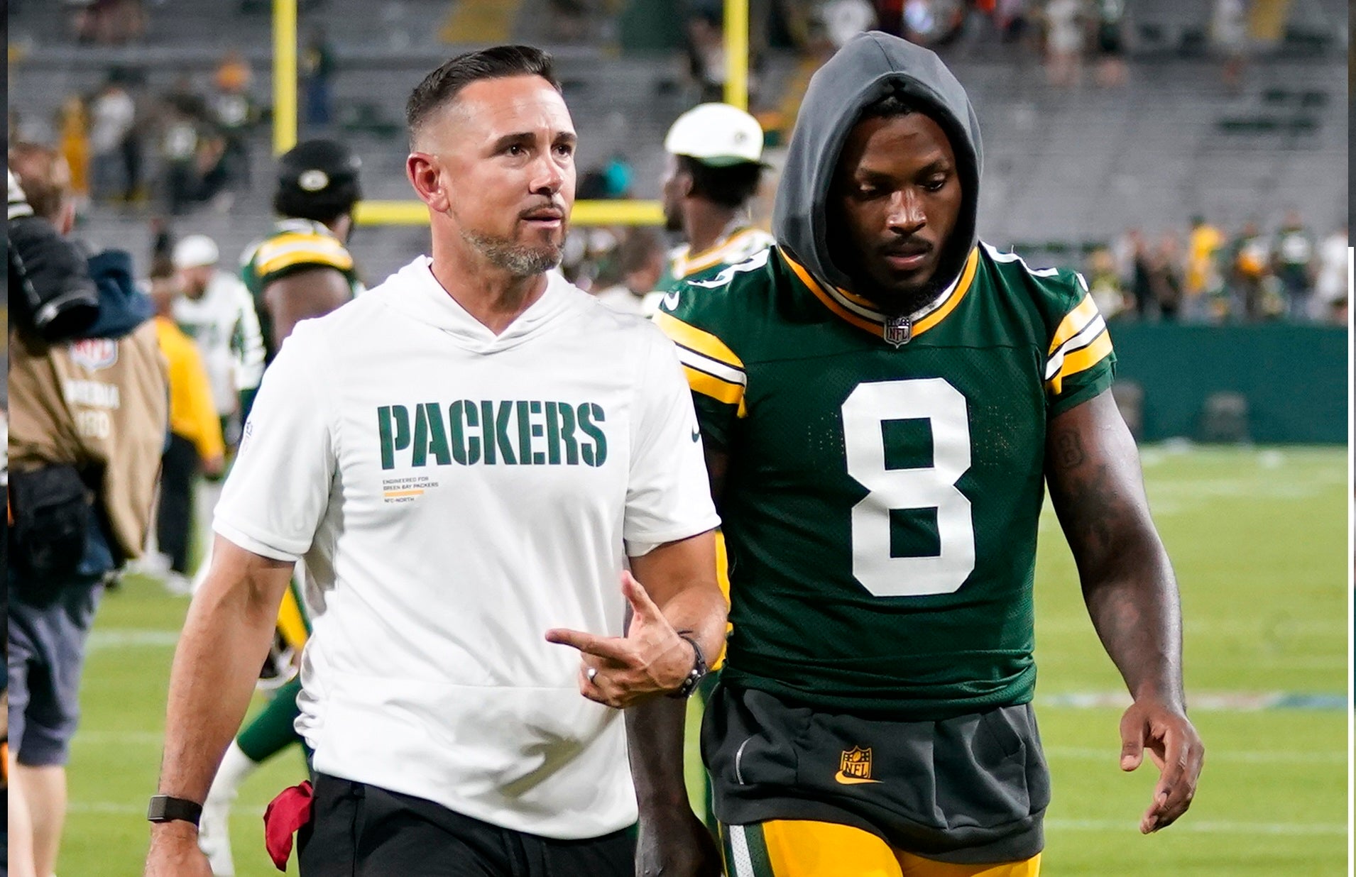 Aug 9, 2025; Green Bay, Wisconsin, USA; Green Bay Packers head coach Matt LaFleur, left, and running back Josh Jacobs (8) walk off the field following a 30-10 loss against the New York Jets at Lambeau Field.