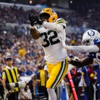 Green Bay Packers running back MarShawn Lloyd (32) and Indianapolis Colts cornerback Chris Lammons (38) miss a long pass on Saturday, Aug. 16, 2025, during a game against the Green Bay Packers at Lucas Oil Stadium in Indianapolis.