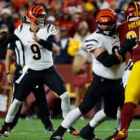Aug 18, 2025; Landover, Maryland, USA; Cincinnati Bengals quarterback Joe Burrow (9) passes the ball as Washington Commanders defensive tackle Daron Payne (94) rushes during the first quarter at Northwest Stadium.