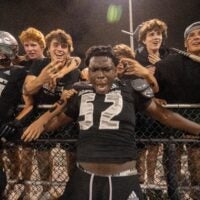 St. Peter Prep's Olubobola Oluwasemilore (52) celebrate with fans during a high school football game between St. Peter’s Prep and Paramus Catholic in Jersey City on Friday, Aug. 29, 2025.