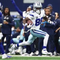 Sep 14, 2025; Arlington, Texas, USA; Dallas Cowboys wide receiver CeeDee Lamb (88) runs with the ball against the New York Giants during the second quarter at AT&T Stadium.