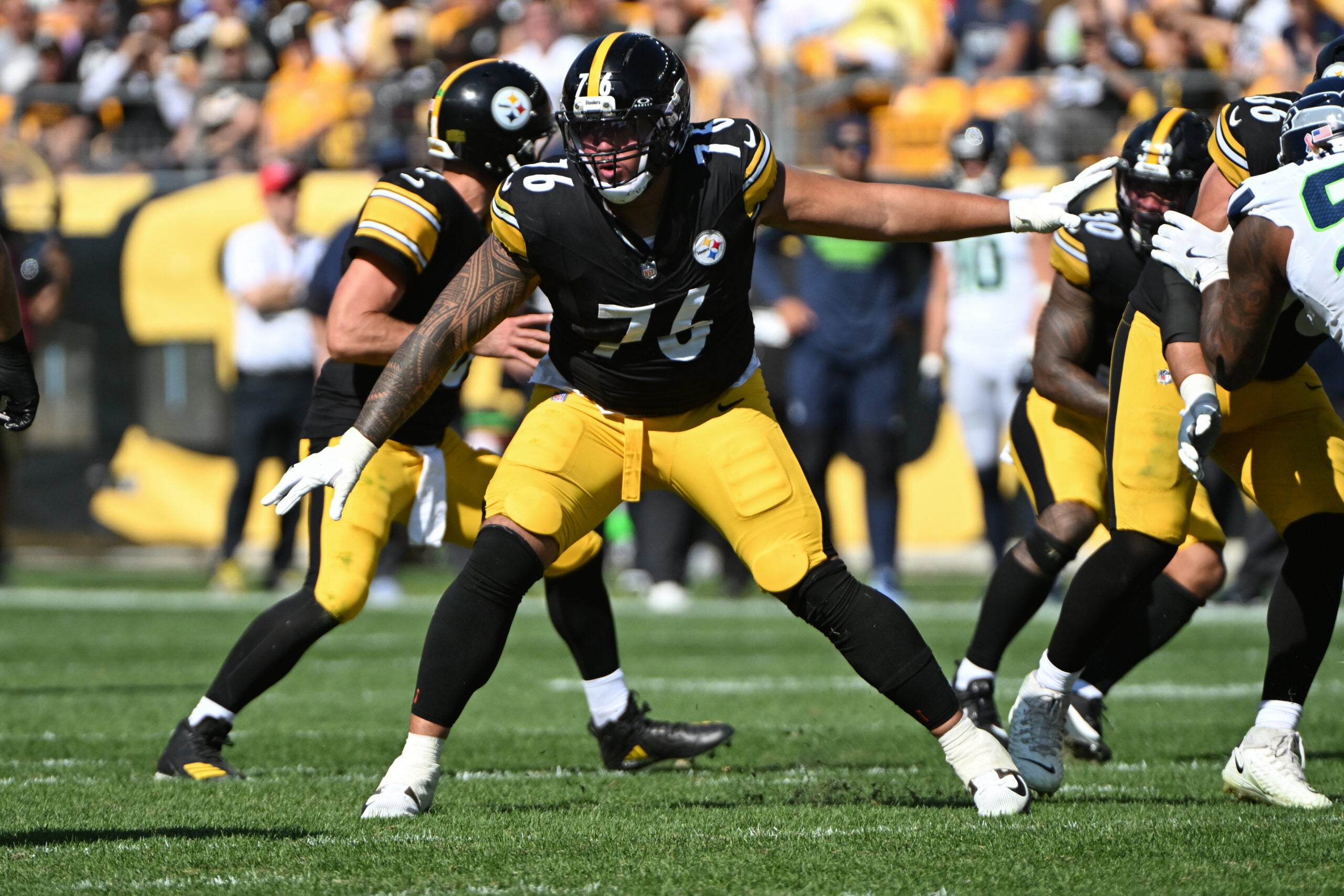 Sep 14, 2025; Pittsburgh, Pennsylvania, USA; Pittsburgh Steelers offensive tackle Troy Fautanu (76) pass blocks against the Seattle Seahawks during the second quarter at Acrisure Stadium.