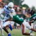 IMG Academy's Osani Gayles (13) rushes for yards against Mandarin's Tamajh Mitchell (7) during the first quarter of a high school football matchup at Mandarin High School, Friday, Sept. 19, 2025, in Jacksonville, Fla. The IMG Academy Ascenders defeated the Mandarin Mustangs 57-7.