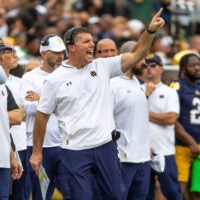 Sep 20, 2025; South Bend, Indiana, USA; Notre Dame Fighting Irish defensive coordinator Chris Ash shouts towards the field against the Purdue Boilermakers during the first half at Notre Dame Stadium.