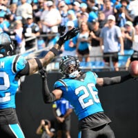 Sep 21, 2025; Charlotte, North Carolina, USA; Carolina Panthers cornerback Chau Smith-Wade (26) celebrates with safety Lathan Ransom (22) after intercepting the ball and scoring a touchdown in the third quarter at Bank of America Stadium.