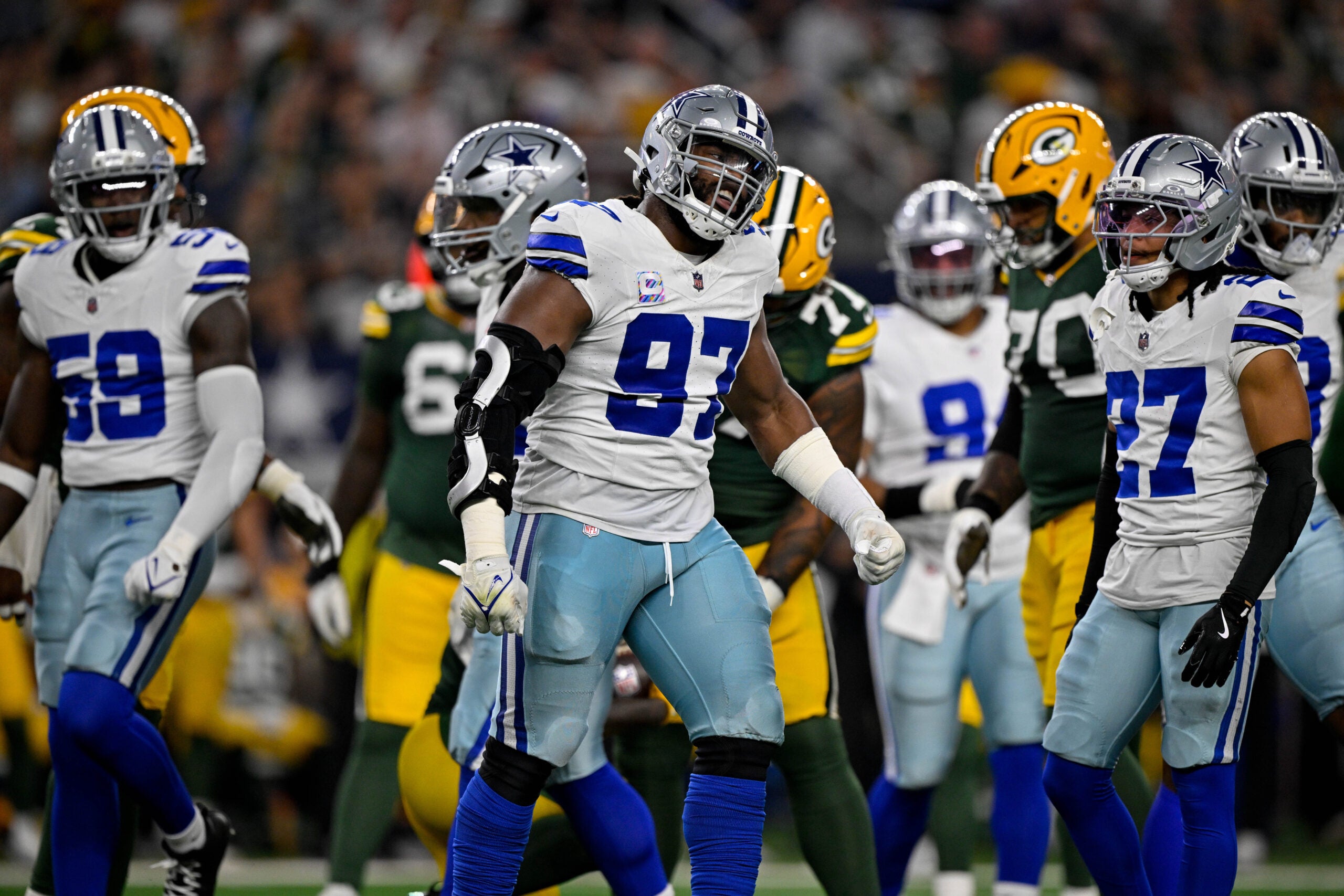 Sep 28, 2025; Arlington, Texas, USA; Dallas Cowboys defensive tackle Osa Odighizuwa (97) celebrates during the game between the Dallas Cowboys and the Green Bay Packers at AT&T Stadium.