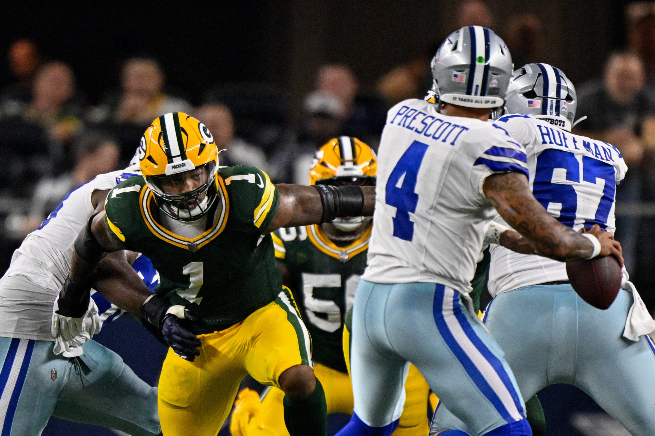 Sep 28, 2025; Arlington, Texas, USA; Green Bay Packers defensive end Micah Parsons (1) rushes against Dallas Cowboys quarterback Dak Prescott (4) during the game between the Dallas Cowboys and the Green Bay Packers at AT&T Stadium.