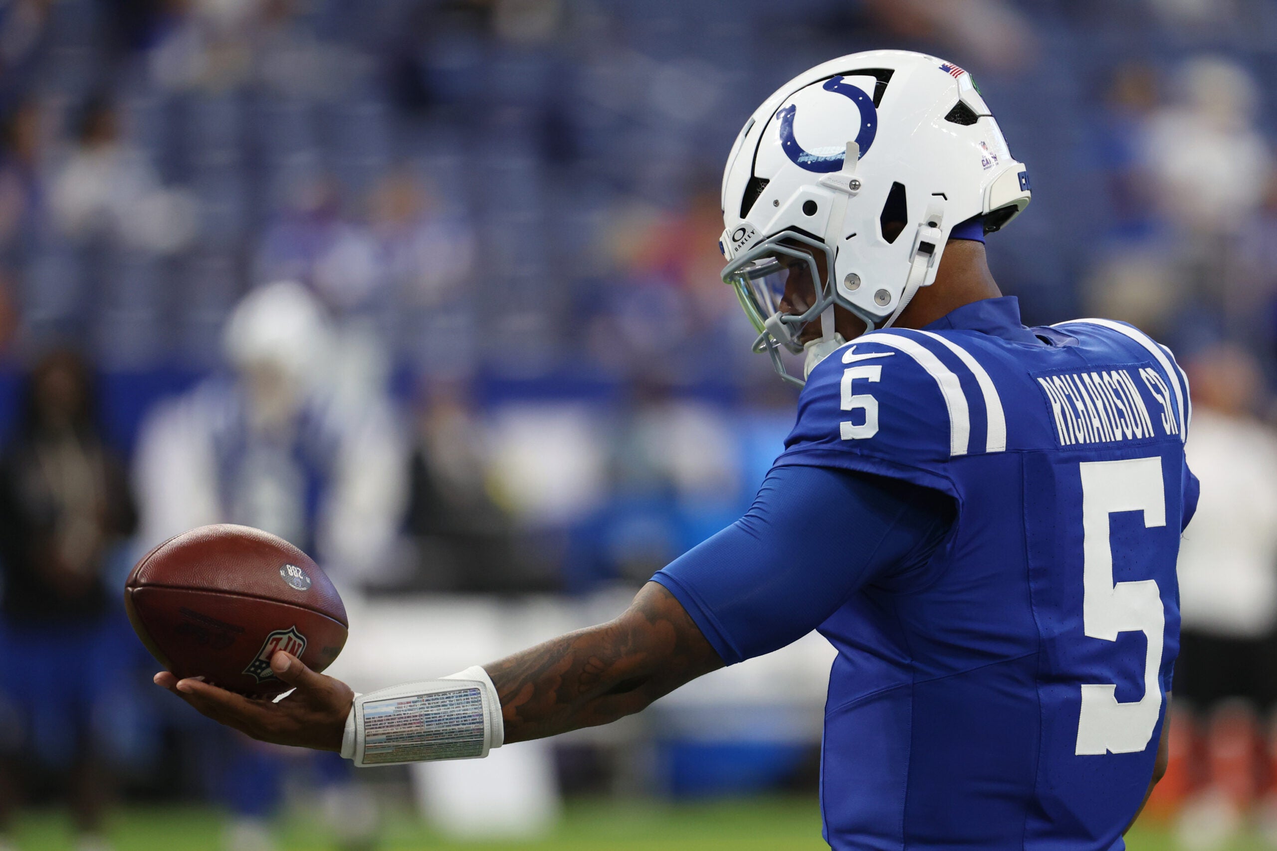 Oct 5, 2025; Indianapolis, Indiana, USA; Indianapolis Colts quarterback Anthony Richardson (5) holds a football during warmups before the game between the Las Vegas Raiders and the Indianapolis Colts at Lucas Oil Stadium.