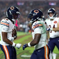 Oct 13, 2025; Landover, Maryland, USA; Chicago Bears running back D'Andre Swift (4) celebrates scoring a touchdown with Luther Burden III (10) during the fourth quarter against the Washington Commanders at Northwest Stadium.