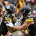 Oct 12, 2025; Pittsburgh, Pennsylvania, USA; Pittsburgh Steelers outside linebacker T.J. Watt (90) celebrates with linebacker Nick Herbig (51) after sacking Cleveland Browns quarterback Dillon Gabriel (8) during the second quarter at Acrisure Stadium.