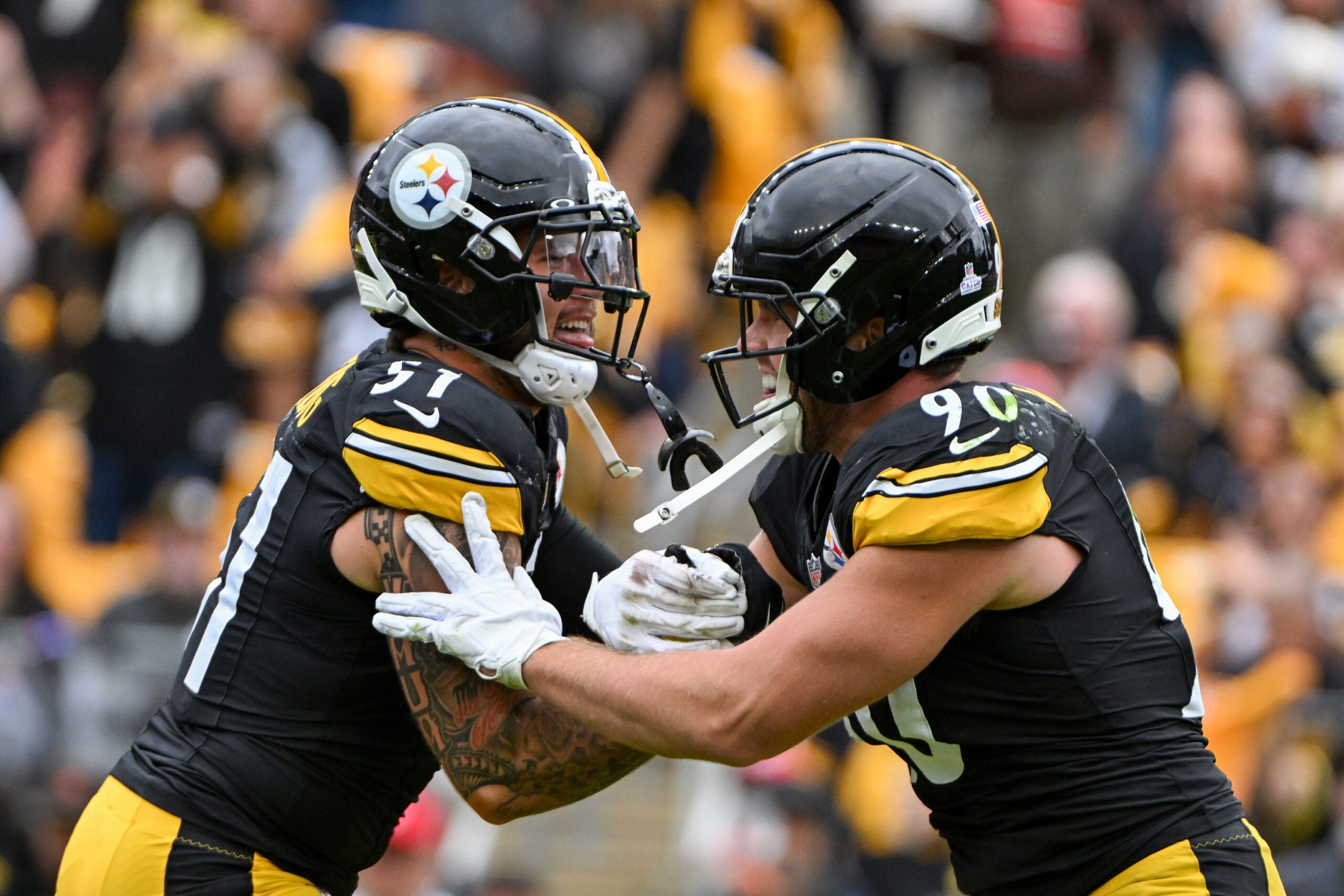 Oct 12, 2025; Pittsburgh, Pennsylvania, USA; Pittsburgh Steelers outside linebacker T.J. Watt (90) celebrates with linebacker Nick Herbig (51) after sacking Cleveland Browns quarterback Dillon Gabriel (8) during the second quarter at Acrisure Stadium.