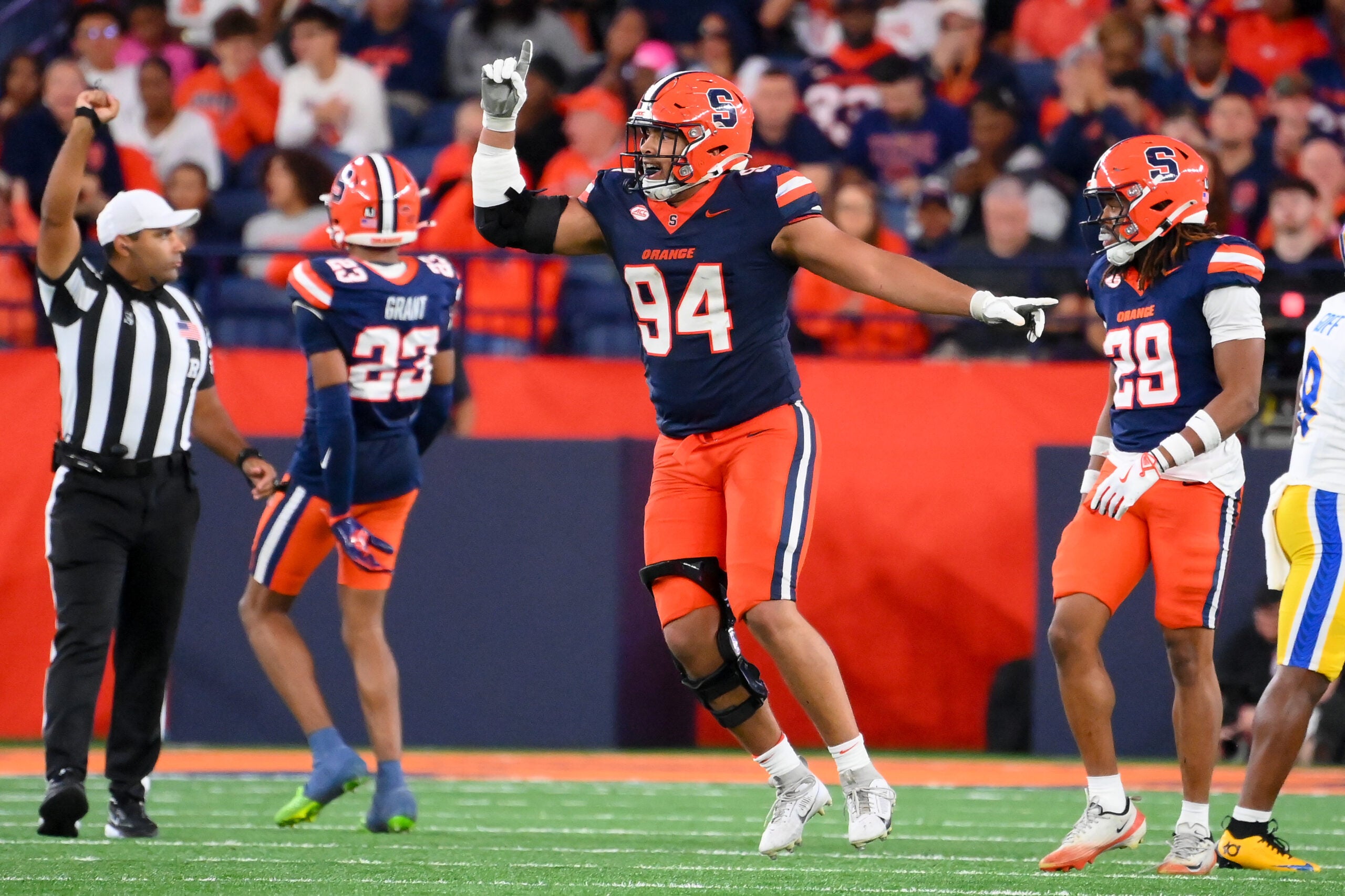 Oct 18, 2025; Syracuse, New York, USA; Syracuse Orange defensive lineman Kevin Jobity Jr. (94) reacts to a defensive play against the Pittsburgh Panthers during the second half at the JMA Wireless Dome.