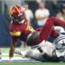 Oct 19, 2025; Arlington, Texas, USA; Washington Commanders quarterback Jayden Daniels (5) fumbles the ball defended by Dallas Cowboys linebacker Shemar James (50) during the third quarter of the game at AT&T Stadium.