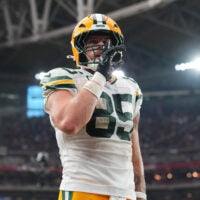 Oct 19, 2025; Glendale, Arizona, USA; Green Bay Packers tight end Tucker Kraft (85) celebrates a touchdown against the Arizona Cardinals during the second half at State Farm Stadium.