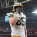 Oct 19, 2025; Glendale, Arizona, USA; Green Bay Packers tight end Tucker Kraft (85) celebrates a touchdown against the Arizona Cardinals during the second half at State Farm Stadium.