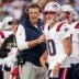New England Patriots coach Mike Vrabel talks to quarterback Drake Maye (10) during the second quarter at Nissan Stadium in Nashville, Tenn., Sunday, Oct. 19, 2025.
