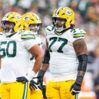 Oct 19, 2025; Glendale, Arizona, USA; Green Bay Packers offensive lineman Zach Tom (50) and guard Jordan Morgan (77) against the Arizona Cardinals at State Farm Stadium.